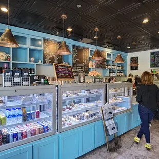 a woman standing in front of the counter