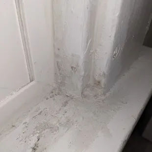 Sloppy caulking and smeared all over antique woodwork