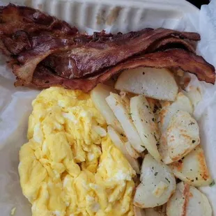 3 eggs with bacon and home fries platter.