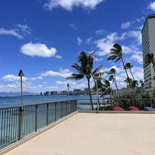 Huge lanai upstairs, with a beautiful view of the ocean and palm trees!