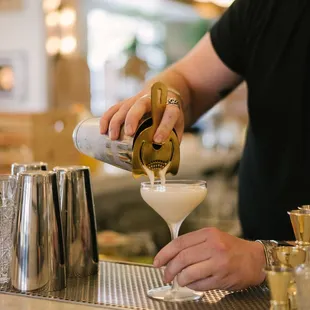 a bartender making a cocktail