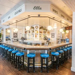 a bar with blue stools
