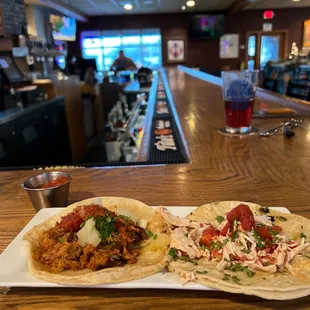 two tacos on a table