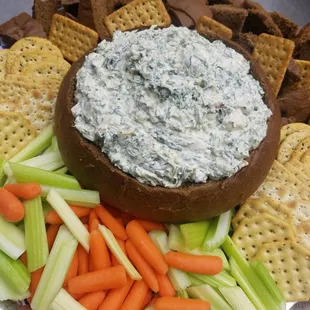 Spinach dip bread bowl with carrots , celery , crackers and chunks of bread! Call need an event catered?   920-457-3034, ask for Walter
