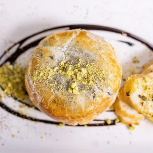 a white plate with bread and pastry
