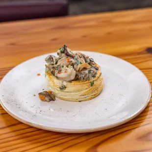 a plate of food on a wooden table
