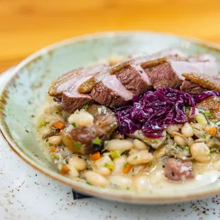 a plate of food on a wooden table