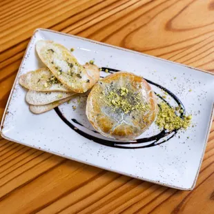 a plate of food on a wooden table