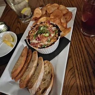 a platter of bread and dips