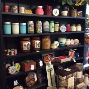 Cabinet with many soy candles from R&amp;R Candles.