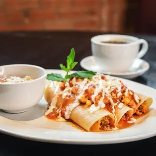 a plate of lasagna and a cup of coffee