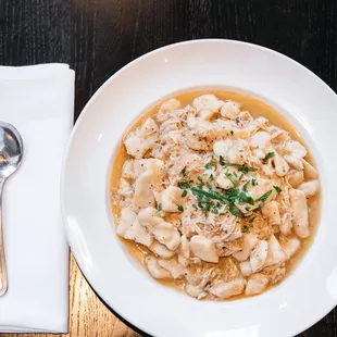 a bowl of pasta and a spoon