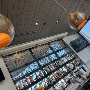 a bar with a lot of bottles on the counter