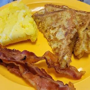 French toast plate with eggs &amp; bacon.