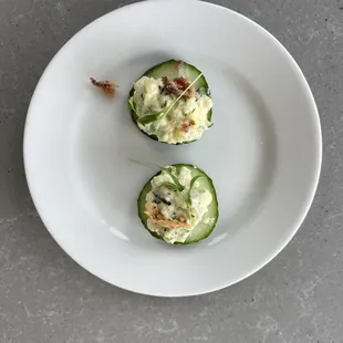 two cucumbers on a plate