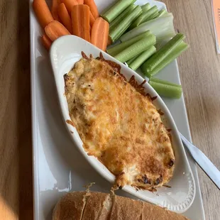 Buffalo chicken dip with carrots, celery, and bread