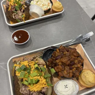 Pulled pork baked potatoes with cole slaw and baked beans and corn muffins