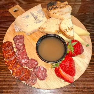 a platter of meat and cheese