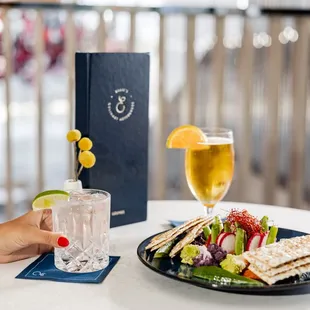 a plate of food and a glass of wine