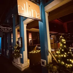 the entrance to a restaurant at night