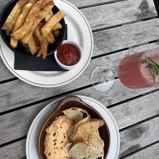 Parmesan herb French fries, pimento cheese dip, and starry eyed cocktail