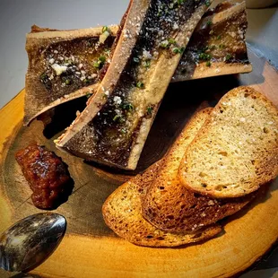 a plate of bread and a spoon