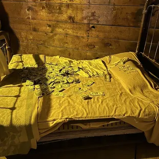 Cash money on the beds, to keep the spirits away
