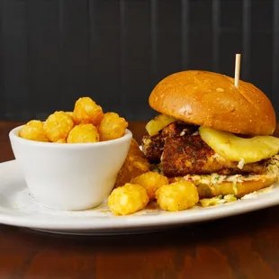 a burger with a side of macaroni and cheese