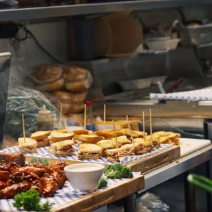 a variety of sandwiches on a cutting board