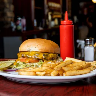 Cheese Burger: 7oz Royal Ranch patty, cheddar cheese, lettuce, tomato, onion, pickles, pub sauce, on a spent grain bun from our breweries.