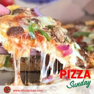 a person taking a slice of pizza