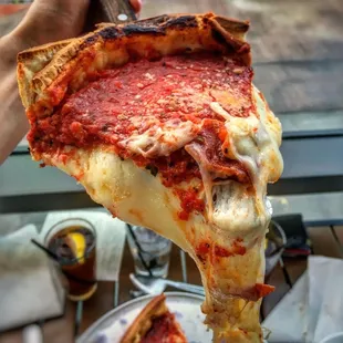 a slice of deep dish pizza