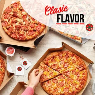 a pizza in a box with a slice taken out of it