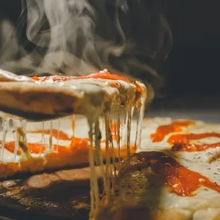 The smell of a pizza is what makes you get to eat another one! Get that delicious, mouth-watering flavor in every bite with Elliott pizza