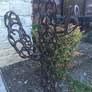 Cactus yard decoration made of horseshoes.
