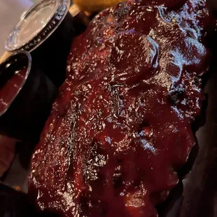 HALF RACK BABY BACK RIBS w/ beer barbecue baked beans, corn on the cob, coleslaw and garlic bread.