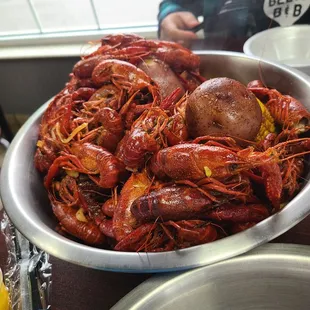 a bowl of craws and potatoes