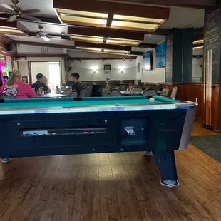Dining Room dominated by pool table. 7 booths and 5 tables