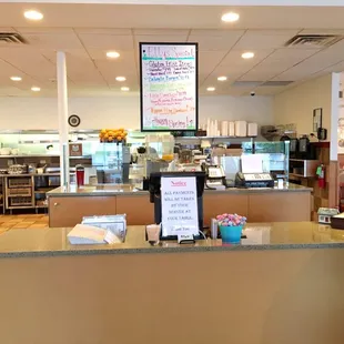 a woman standing at the counter