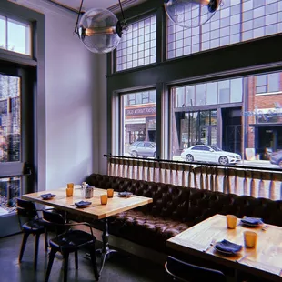 a view of a dining area with tables and chairs