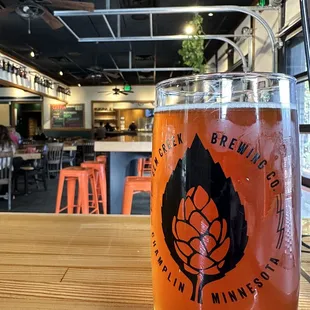 a glass of beer on a table