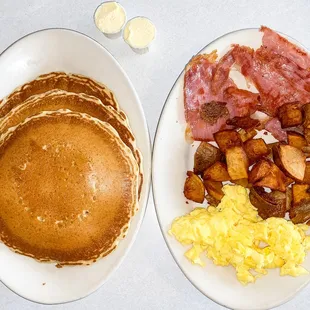 two plates of breakfast food