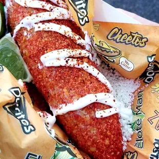 Cuatro: Doritos, Tostitos, Takis, Cheetos, mayo, cotija cheese, chili powder, and some lime.