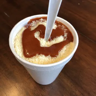  cup of coffee with a spoon sticking out of it