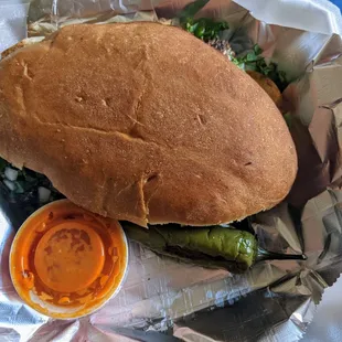Torta de barbacoa, with avocado, cilantro, and onion