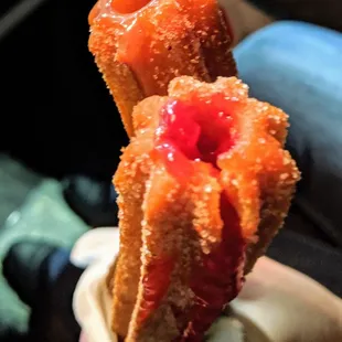 a person holding a donut