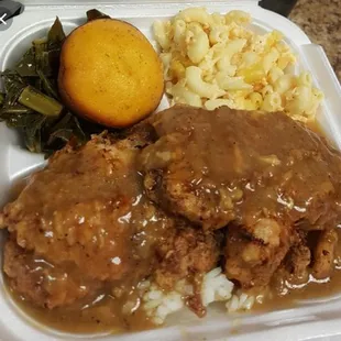 Smotthered Pork Chops &amp; Rice, Collard greens, Mac &amp; Cheese. Cornbread muffin