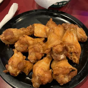 a plate of chicken wings