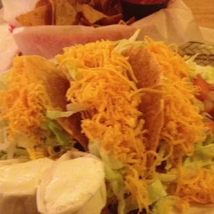 "Tacos". There is nothing Mexican about this Mexican restaurant. This place is Taco Bell waitresses and booze. Take a pass.