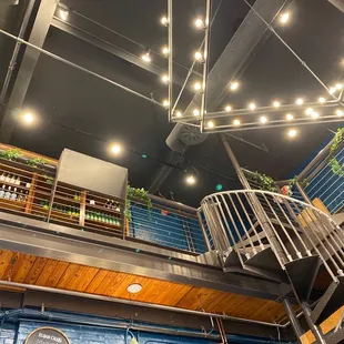 a spiral staircase leading to a second floor